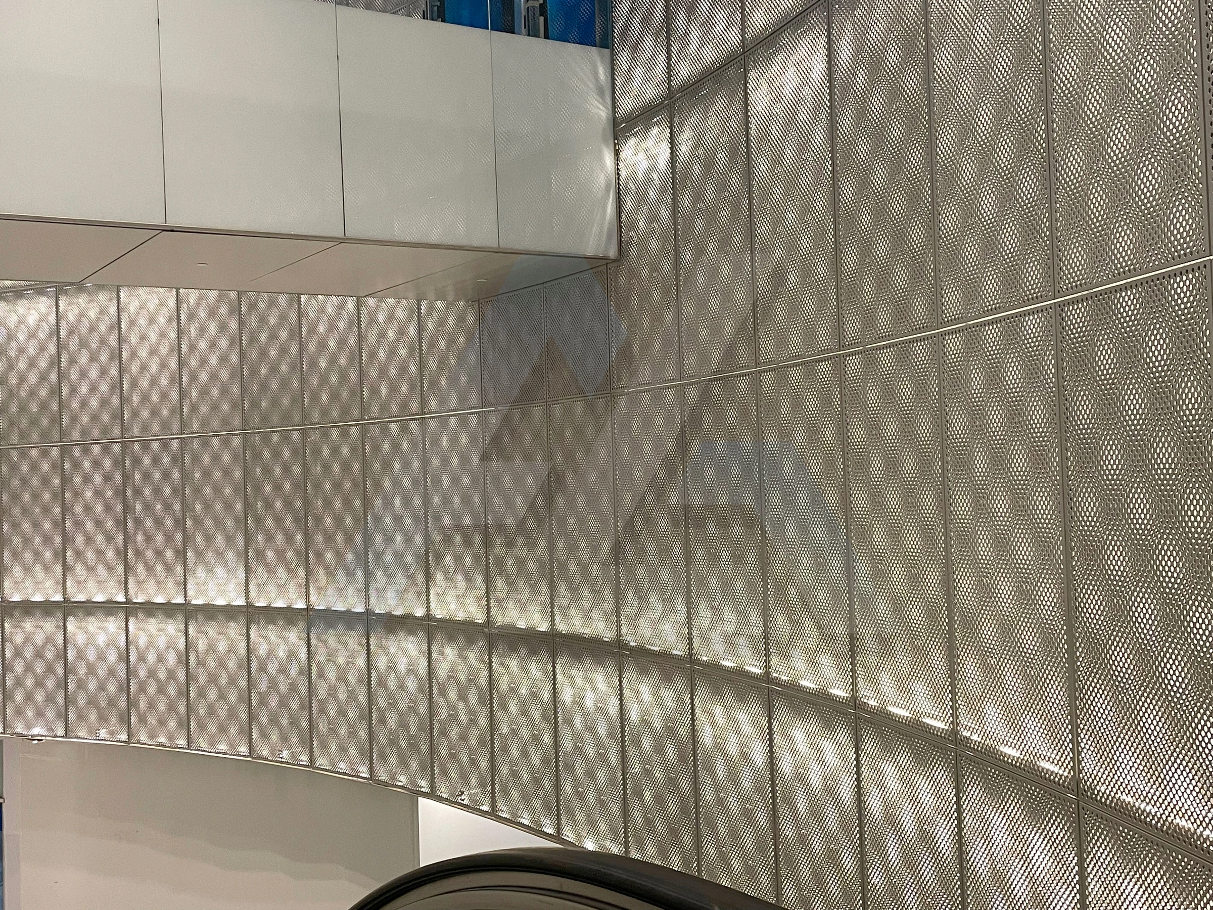 Perforated metal wall panels